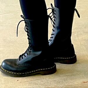 Black lace up mid calf air walk boots.